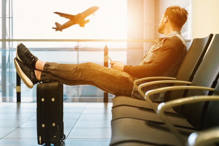 man at the lounge waiting to board a plane